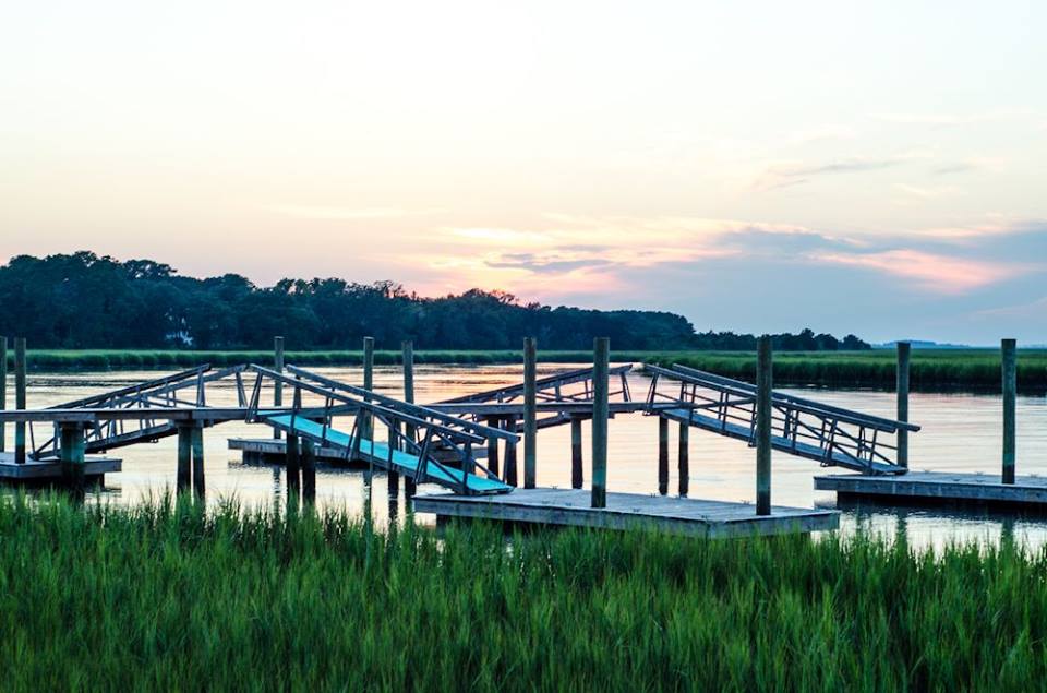 View of docks and marsh at sunset.