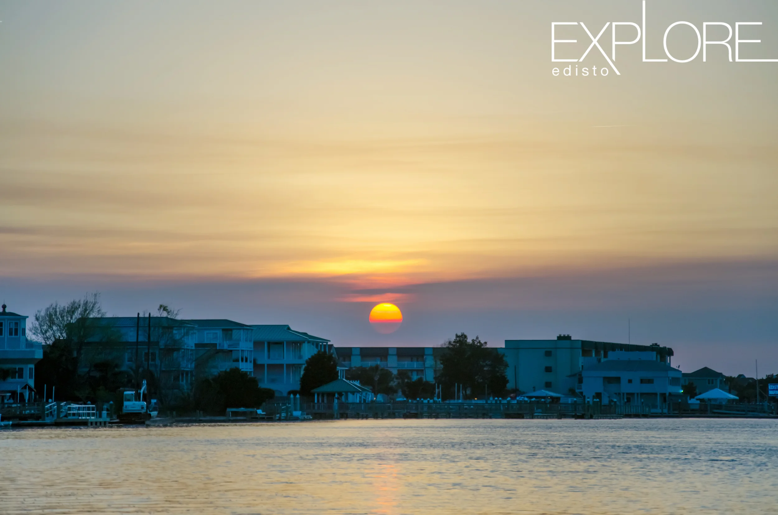 sunsetting over the marina at edisto beach from the water.