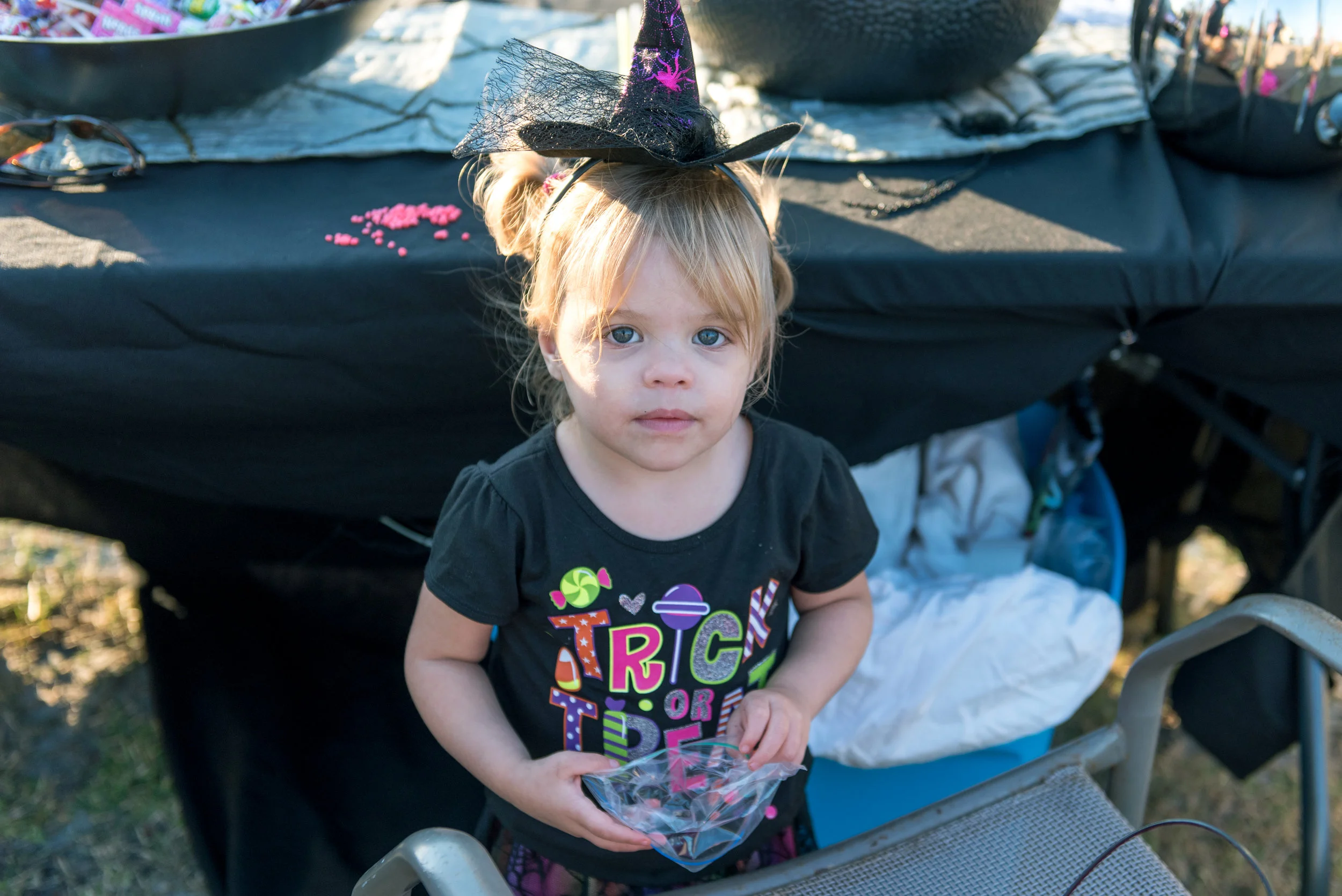 Young person dressed as a witch.