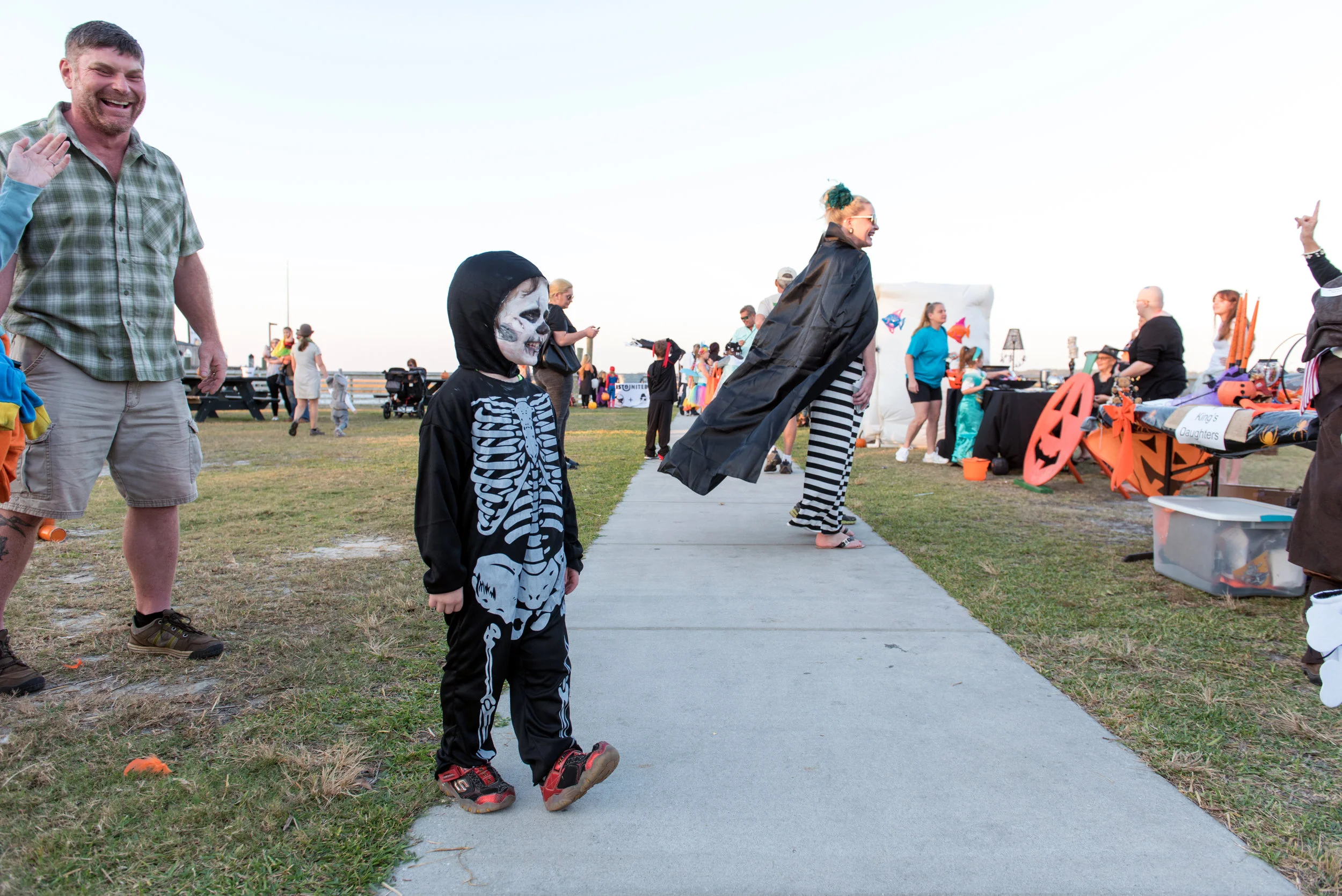 Young person wearing skeleton costume at Halloween people.