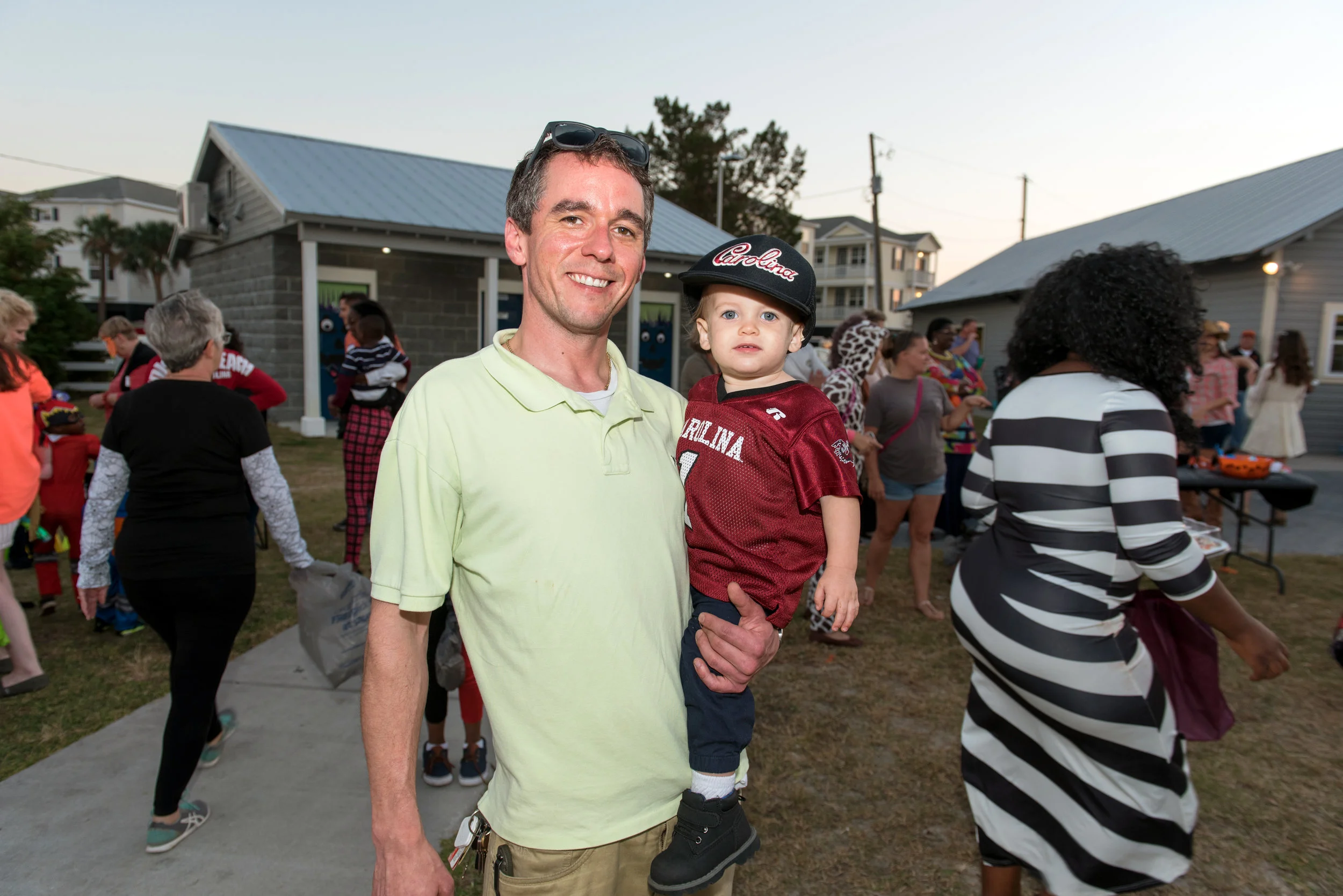 Father and son dressed as football fan at Halloween festival.