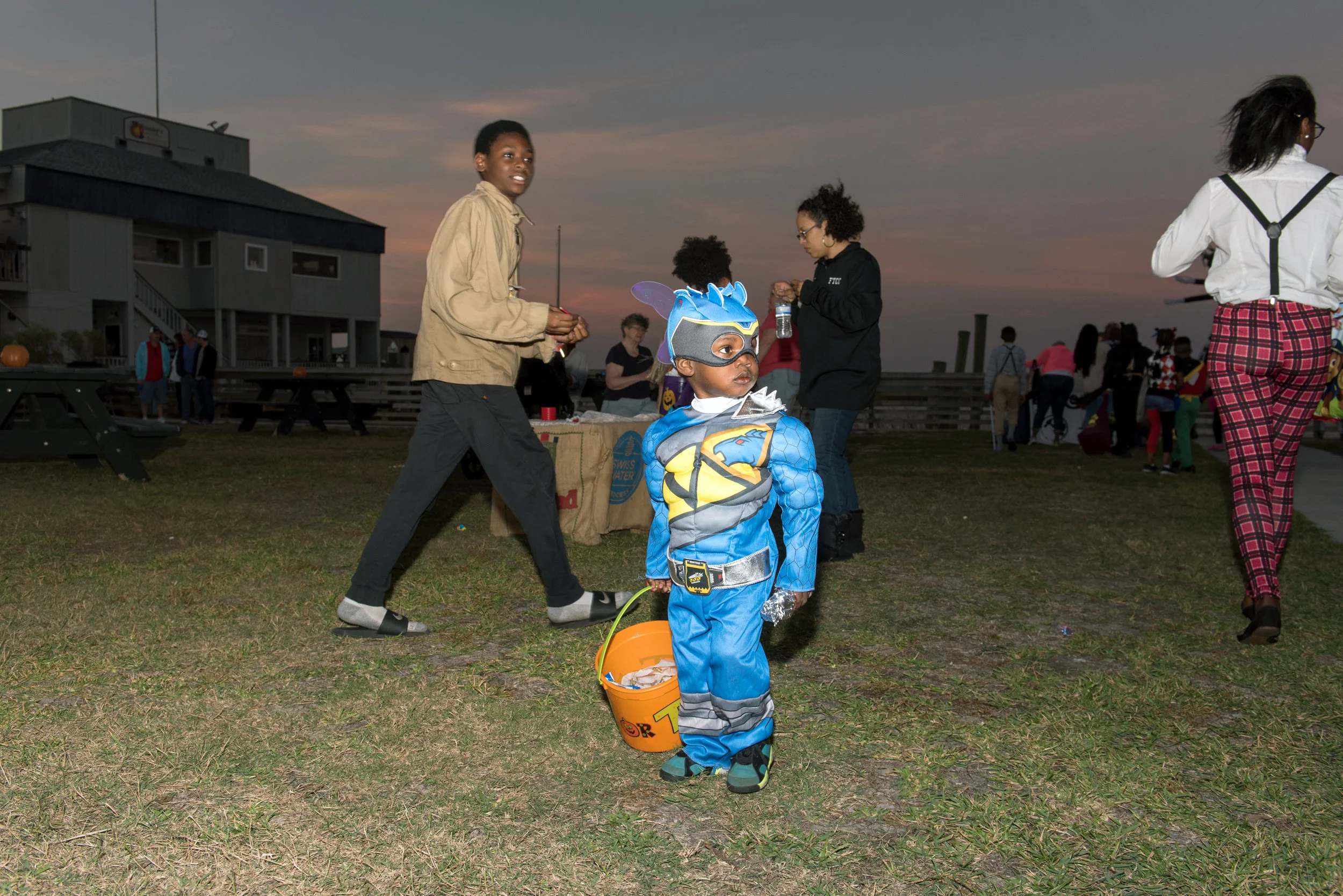 Young person dressed as super hero at Halloween festival