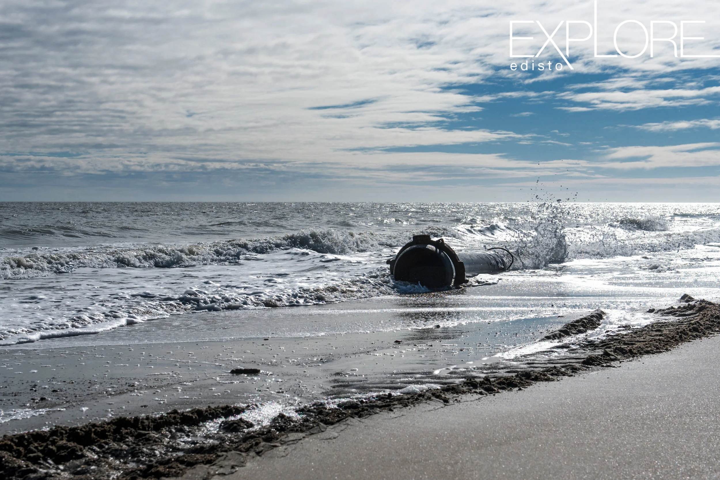 Pipe in the ocean to pump sand onto the beach.