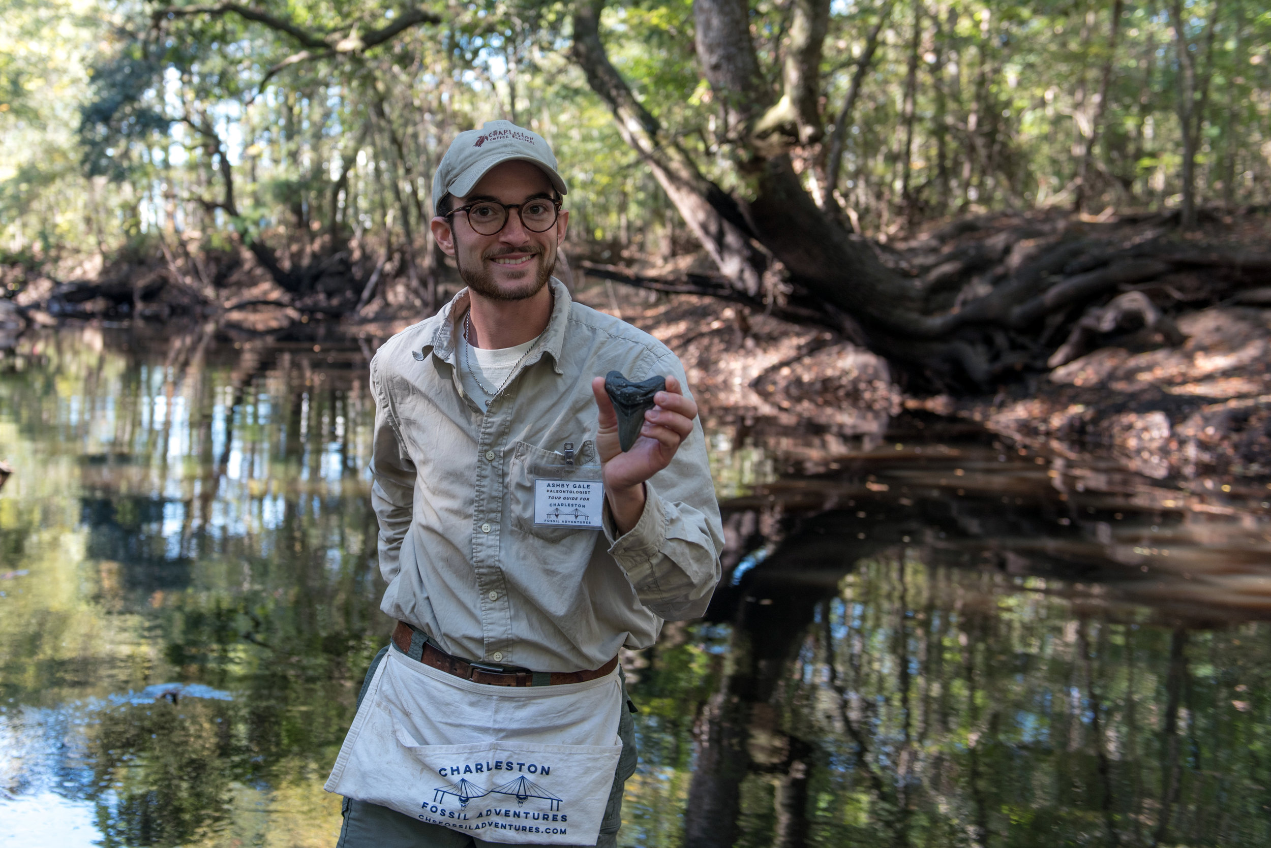 Ashby Gale of Charleston Fossil Adventures showing off his megalodon tooth.