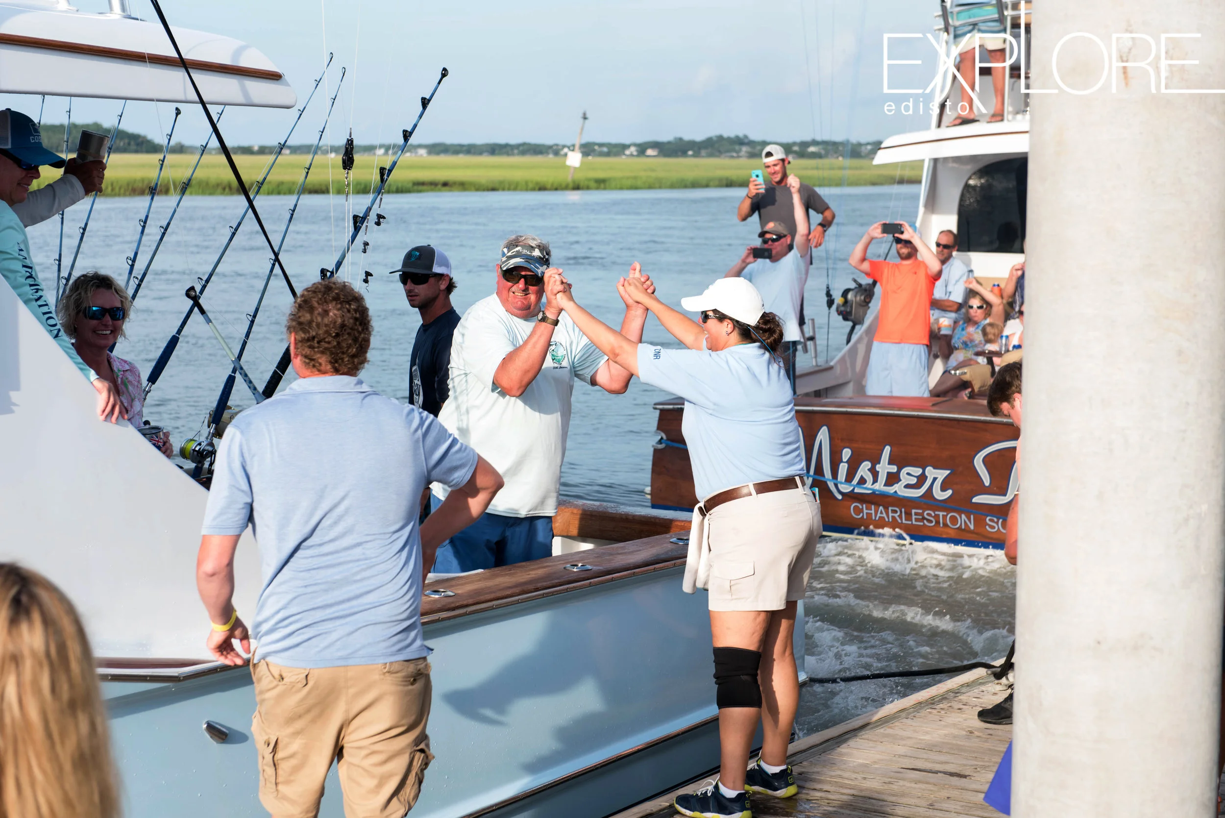 Grasping hands in celebration of a big catch.