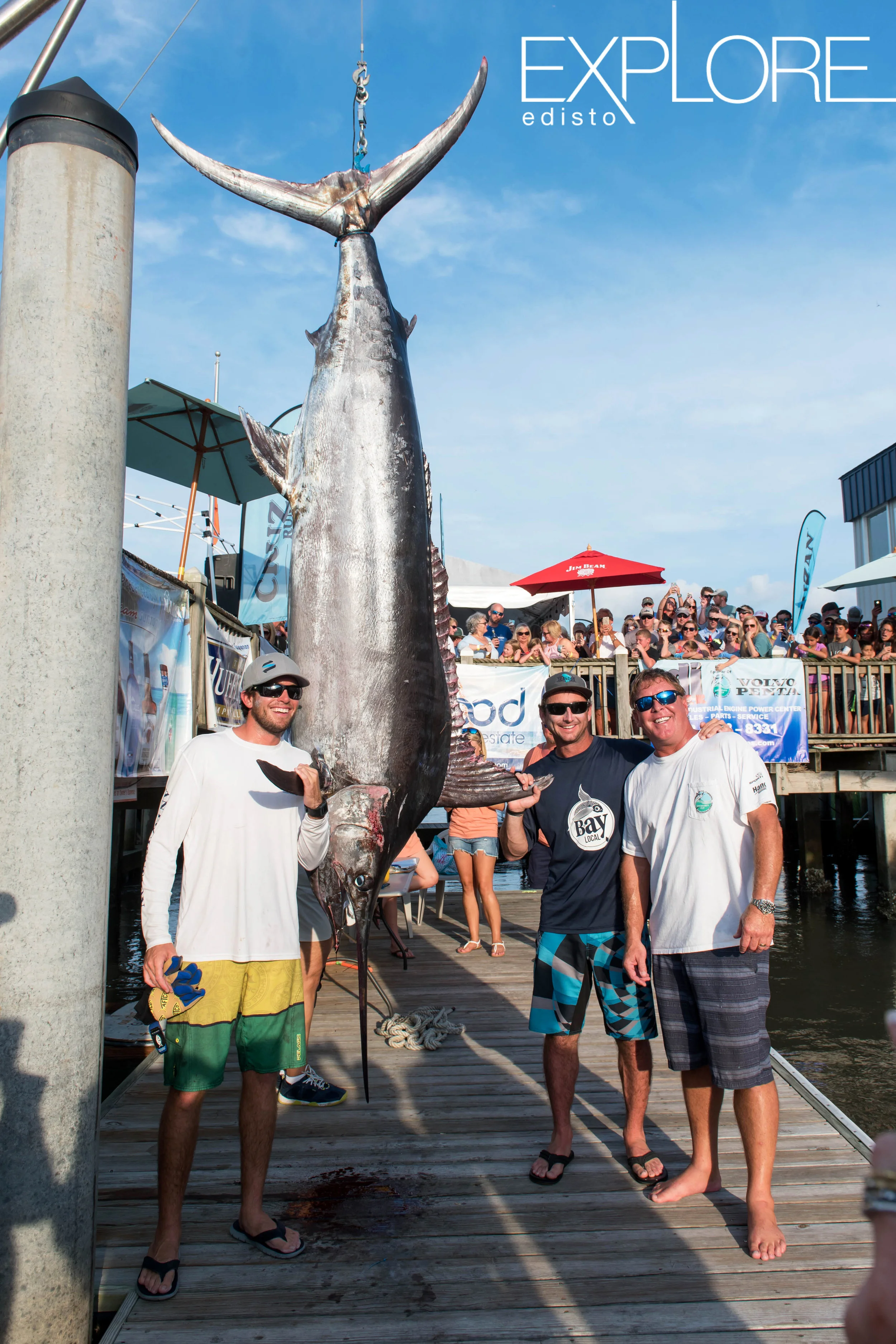 Fishermen posing with massive marlin at SC Governors Cup Billfishing Tournament.