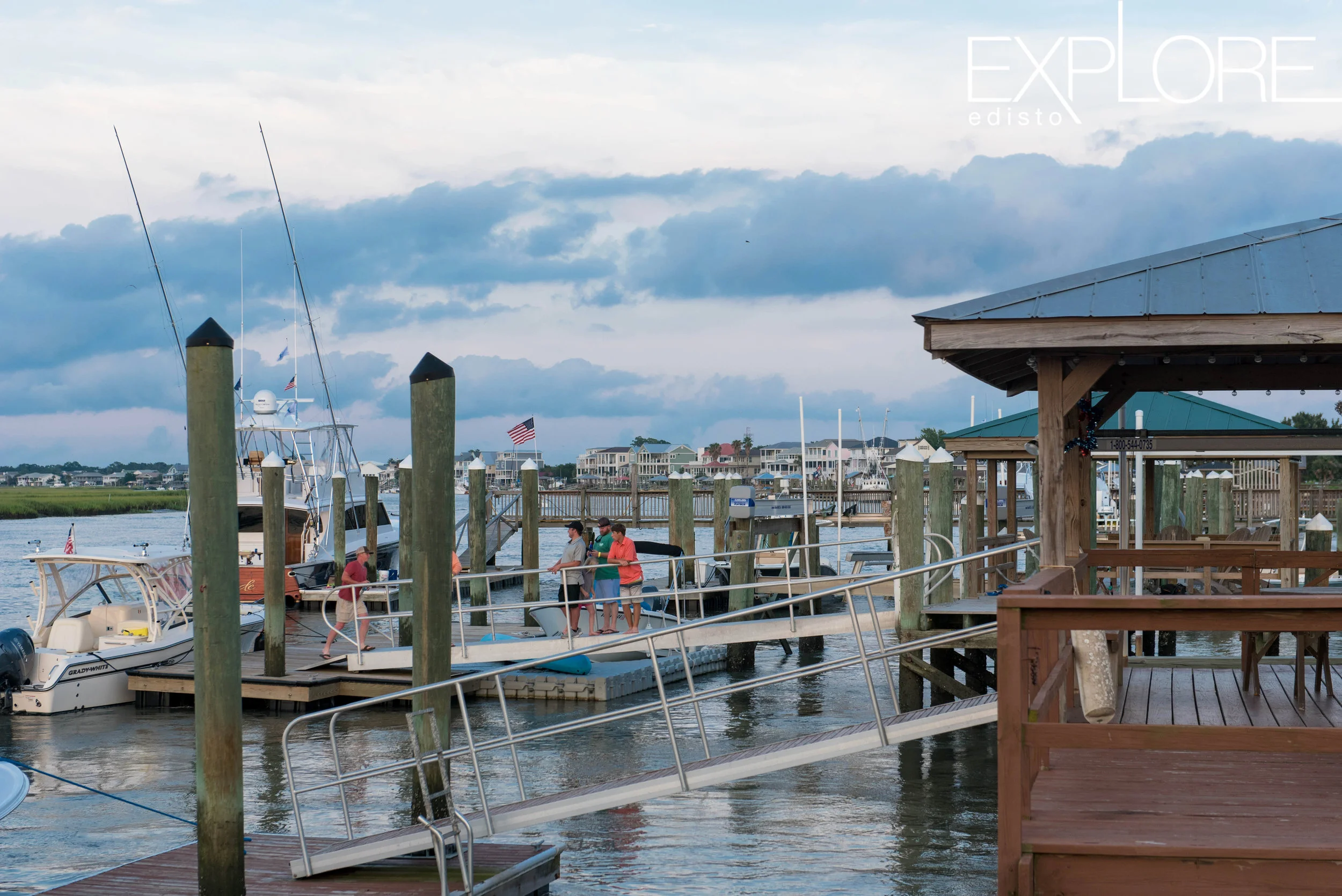 Cloudy sky and docks down Big Bay Creek.