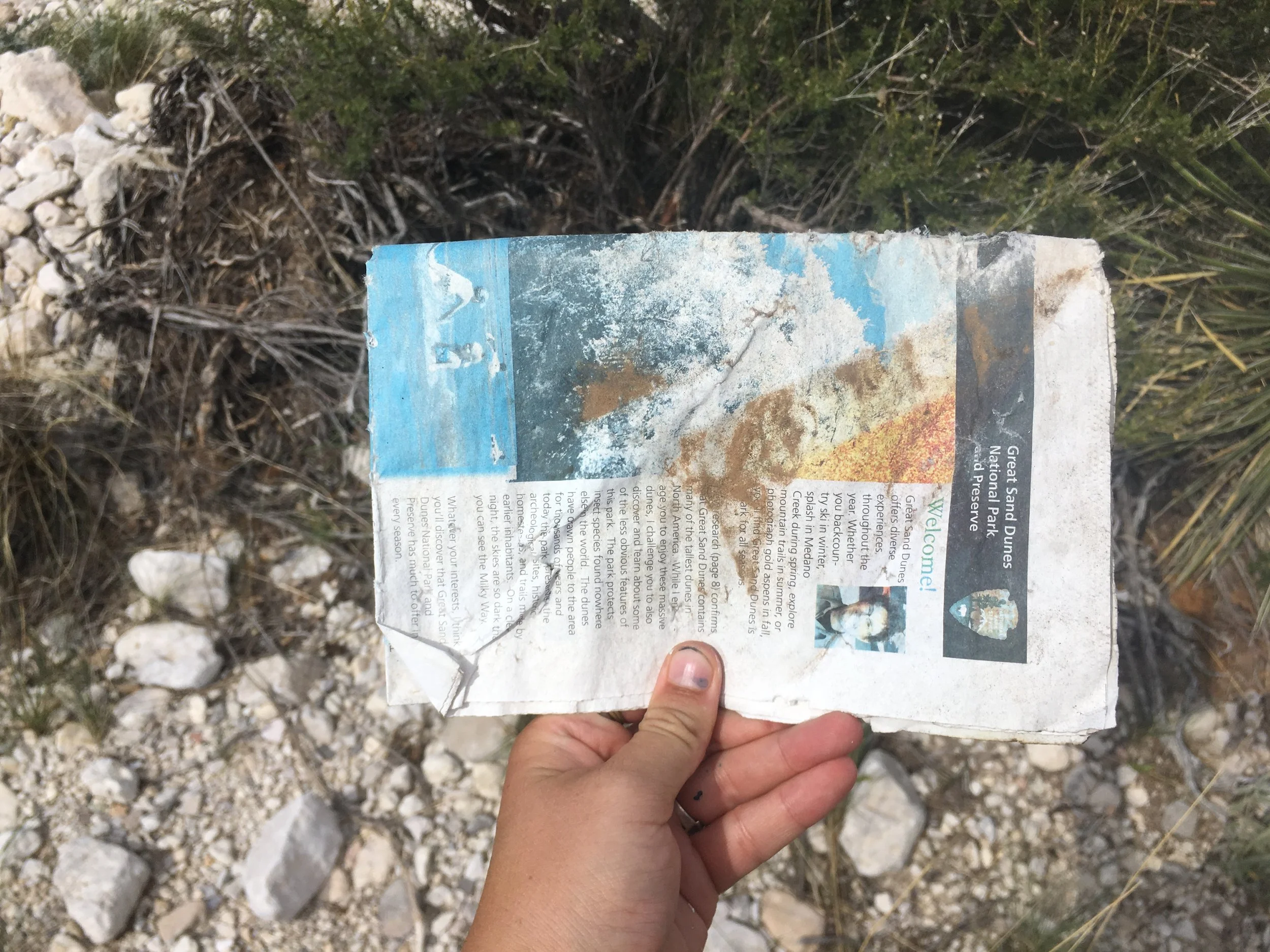 Great Sand Dunes National Park newspaper found at the entrance of the Guadalupe Mountains National Park (497 miles away!)