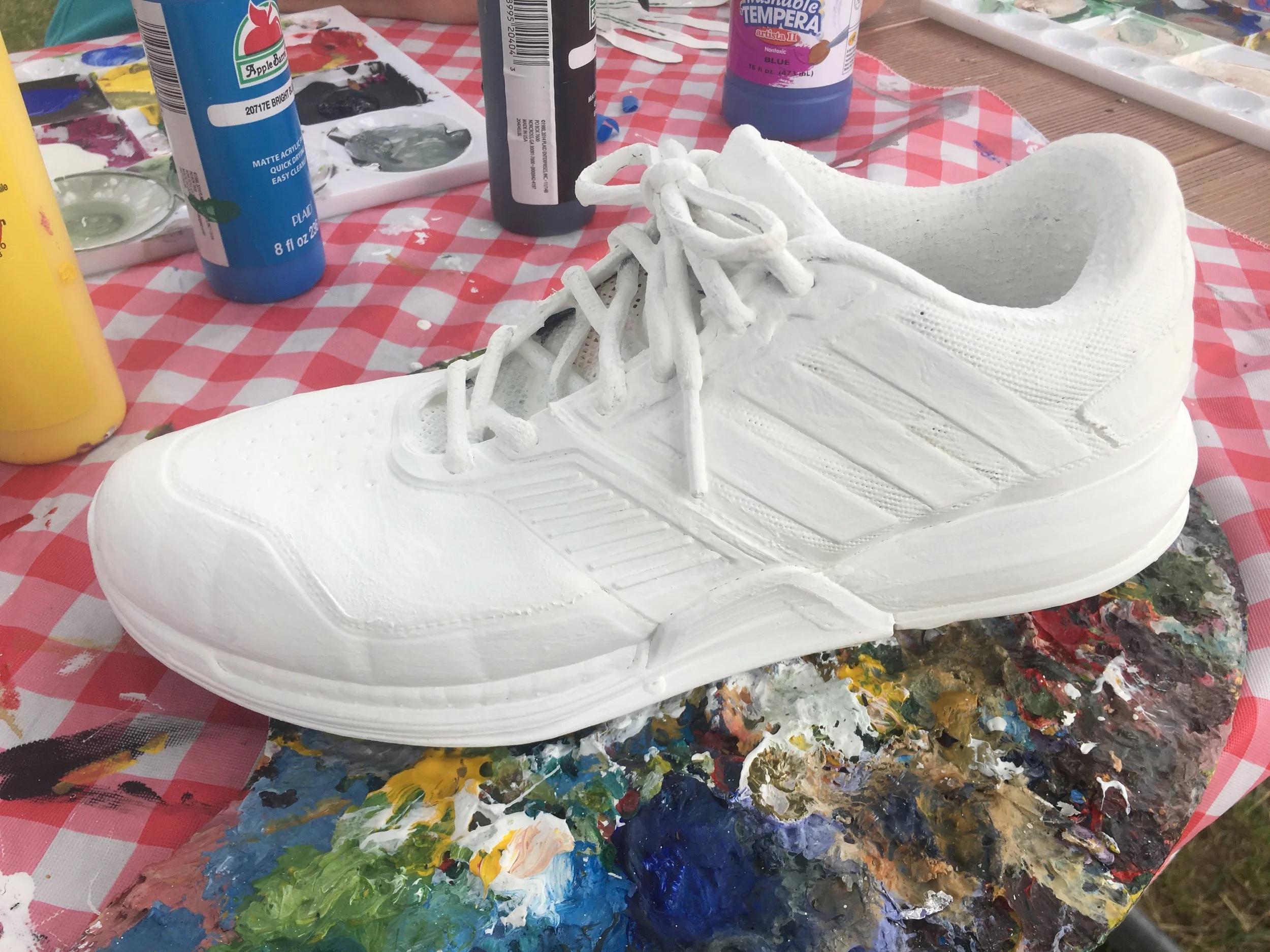 Step 2: Prime shoe with gesso. This not only makes it an easier surface to paint on, but for tricky areas like the laces it kind of acts like a glue. 