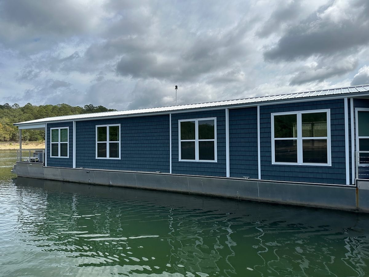 The Boathouse is finally back to her beautiful self after the June hailstorm!  New roof, siding, canvas and windows were recently completed!  Special thanks to Kincannon Steel Service, AR Upholstery and Marine Services and Wilson&rsquo;s Home Improve