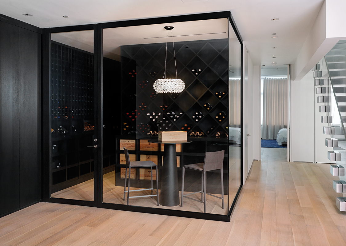  Blackened steel framed wine room. 