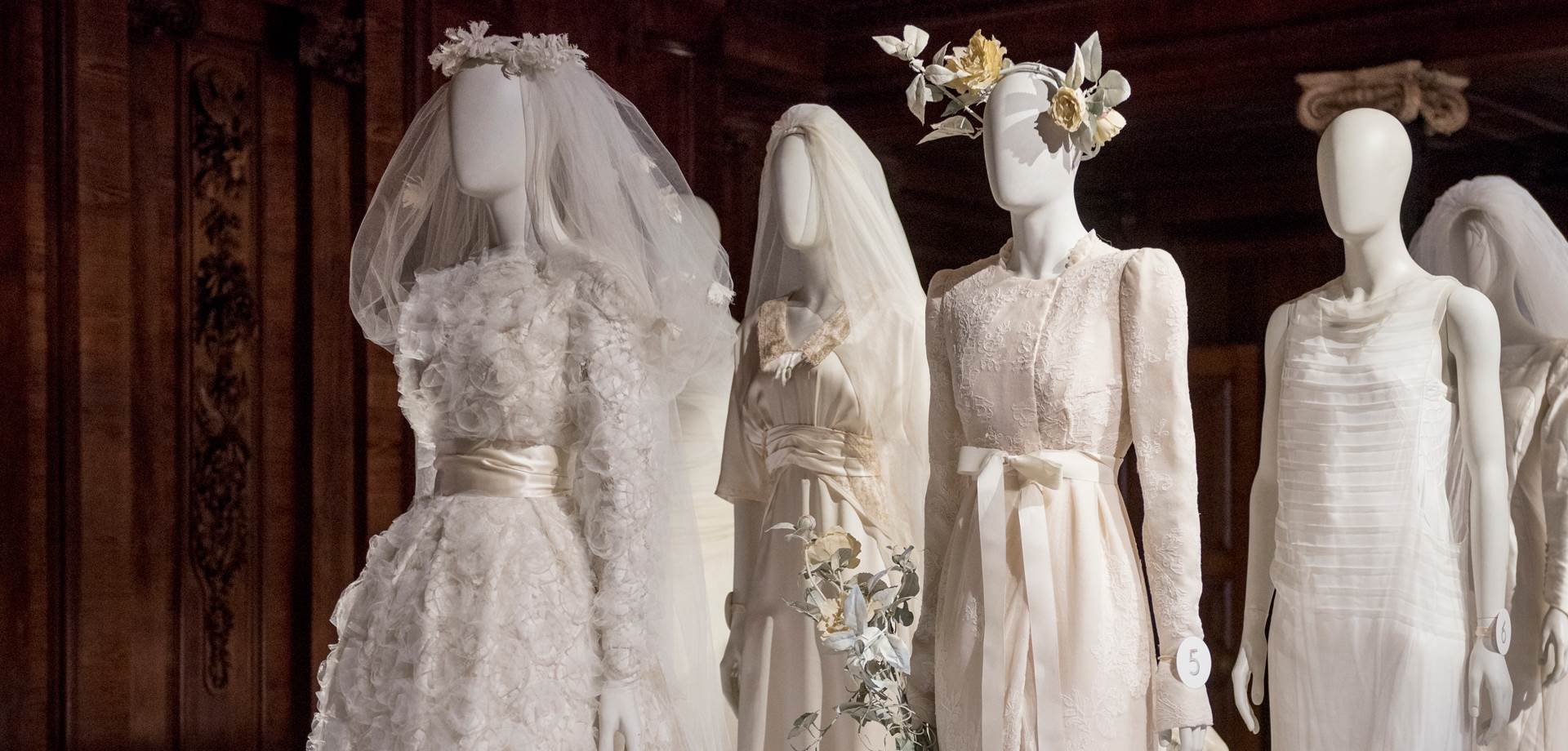  Four wedding  worn  at family weddings displayed in the estates chapel. Image courtesy of Chatsworth Trust. 