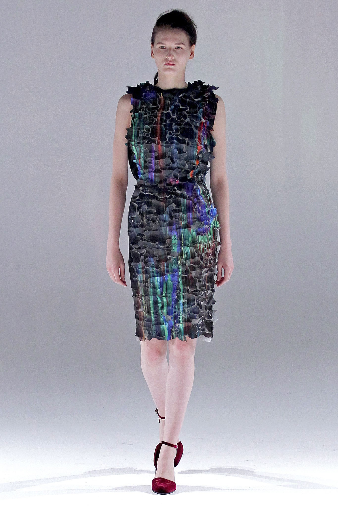  A transforming dress in Hussein Chalayan's Fall 2013 runway show. Image from Vogue.com. 