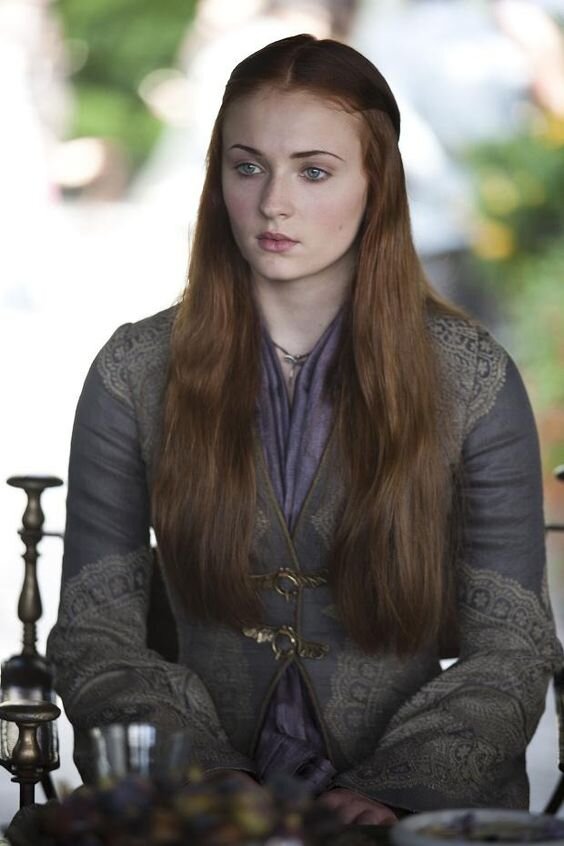  Sansa meets Lady Olenna Tyrell in a purple and grey dress in season three. 
