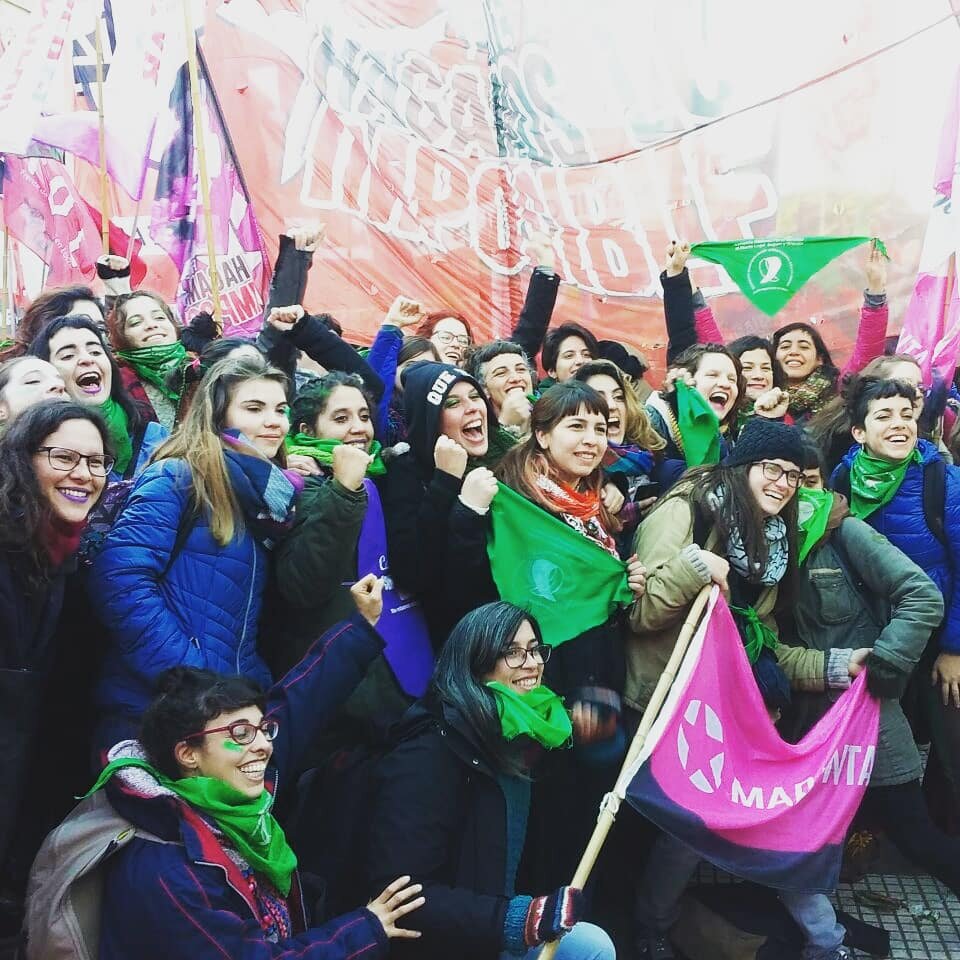  This photo was taken by Candelaria Botto, who mentioned to me that in the winter time, the most important thing is that everyone is dressed for the weather! The handkerchiefs are key, but so are their warm coats. The handkerchief positioned on the n