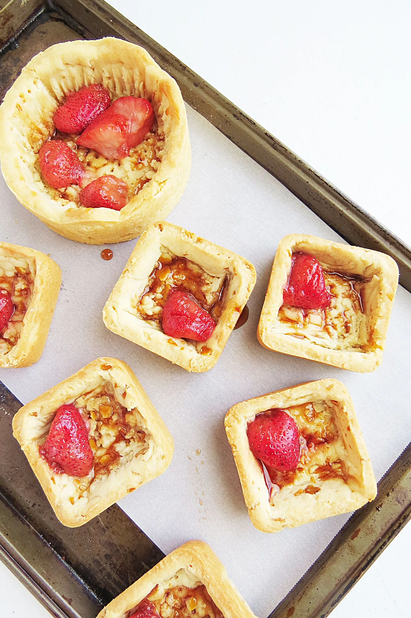 This set has crushed pretzels inside of the dough. It's drizzled with a caramelized strawberry sauce and is then filled with fresh berries and coulis.