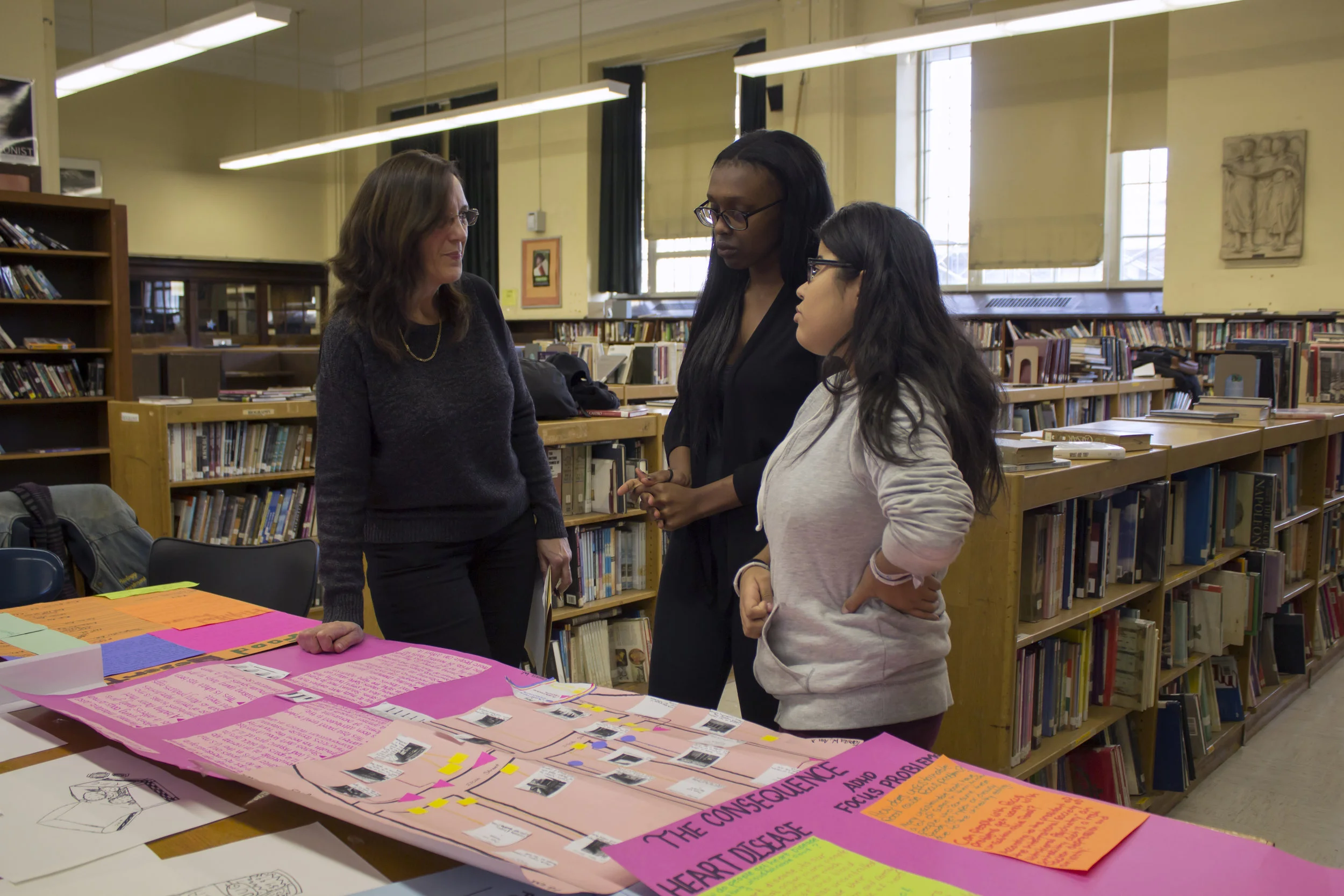 Two students explain their research on hormone imbalance and unhealthy eating to their Assistant Principal.