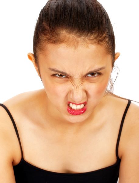 Angry Asian Girl Pulling A Face