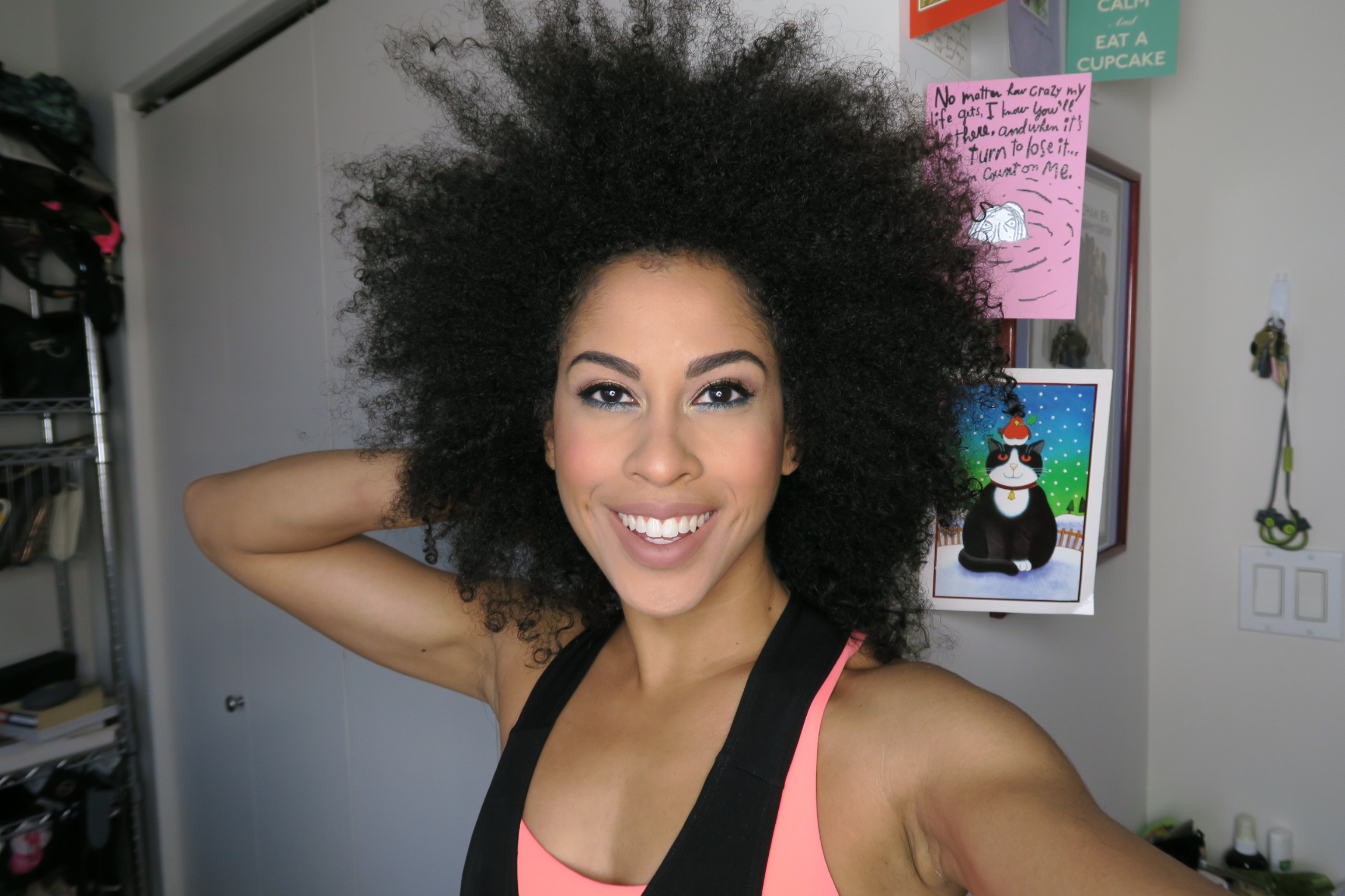 HA! Excuse Mister Christmas Cat! My hair was soft, but as you can see, no elongation and it was back to my original fro shape. Other gels that I've used have more hold and would have put more weight in my hair. The Curl Queen formula is super light--so great if you want to style curly fros. I like my sunflower head! I would def reach for Curl Queen if in need of a faboosh fro!