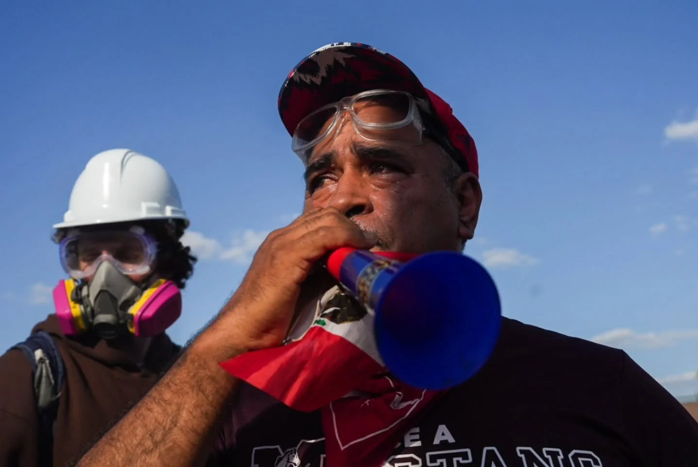 Images from September 27, 10:30 a.m. to 4:00 p.m., outside the Broadview ICE facility. People came and went throughout the morning, holding signs, chanting, and talking with each other. ICE agents were seen carrying buckets labeled 'poison,' likely c