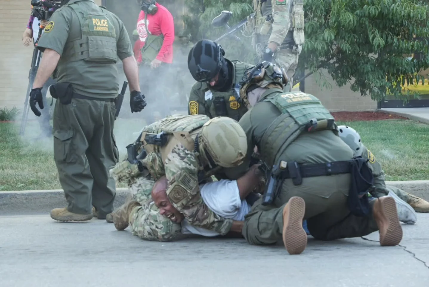 ICE detained three U.S. citizens protesting outside the Broadview facility on September 27. A large, fully militarized group opened the fence blockade on the main street to allow a vehicle through and ordered everyone onto the sidewalk. One man (the 