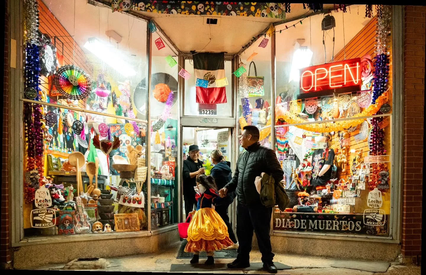 Part 2 

On Halloween night in Little Village, Chicago, trick-or-treaters and their families took to 26th Street as local vendors and businesses handed out candy. The Little Village Community Council coordinated a volunteer effort to patrol the area 