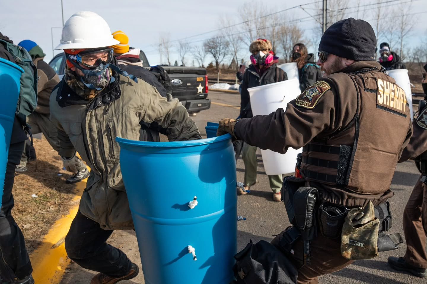 On the morning of March 1, a smaller group gathered in the Fort Snelling North rideshare lot while hundreds of others assembled in the South lot for the official march. Law enforcement began arriving in force at the North lot before the group even st