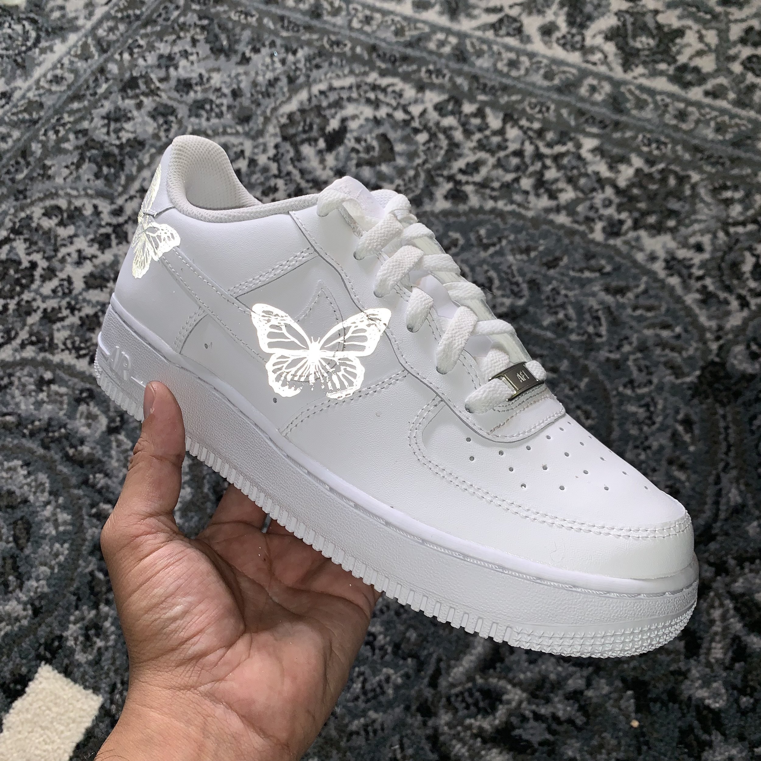 white nike air force with butterflies