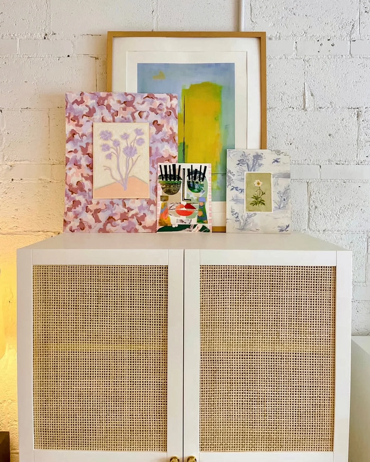 I love this grouping by @thecampbellcollective in @liztewinteriors new design studio! 
Even if you don’t necessarily have an interior designer or struggle to add interest to your space, you can look to art to make a big impact that sets the mo
