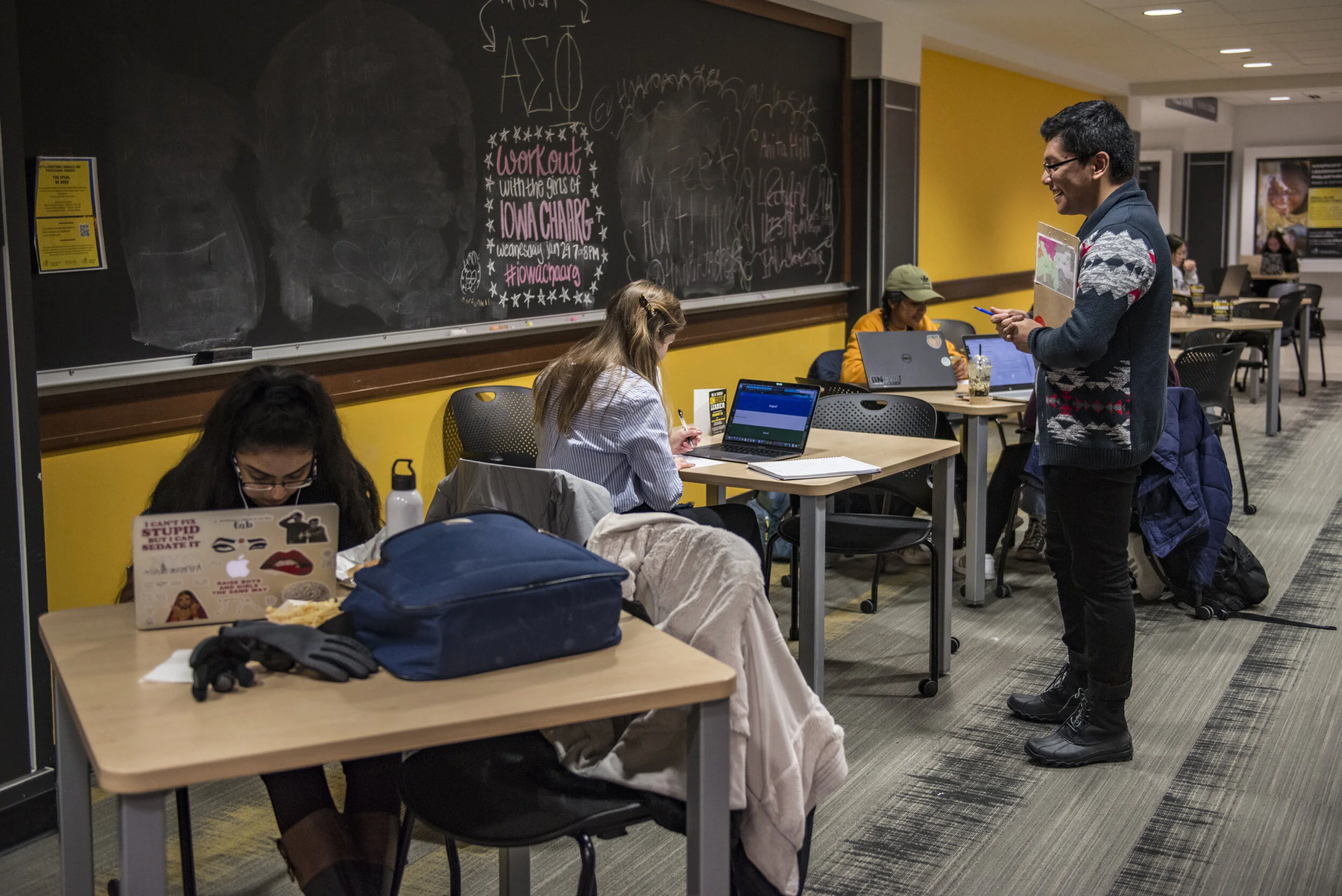  Eddie Garcia speaks with students at the Iowa Memorial Union on the University of Iowa's campus in Iowa City, Iowa on Tuesday, Jan. 28, 2020. Garcia is a field organizer with NextGen Iowa, the state chapter of NextGen America, a national organizatio