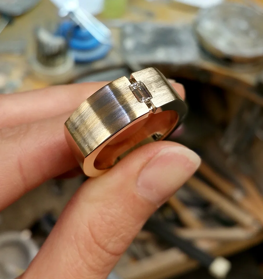 14k two tone gent's ring with baguette diamond