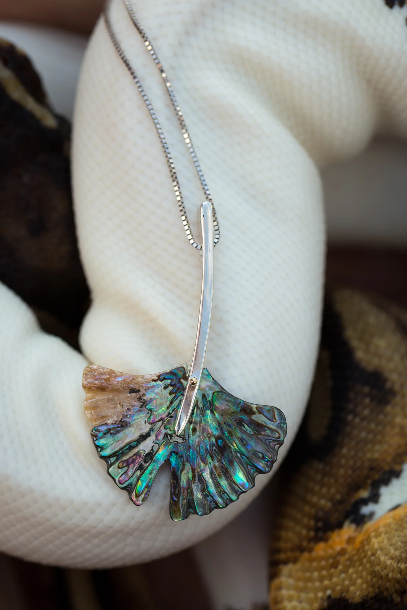 Hand carved paua shell and sterling silver gingko leaf neck