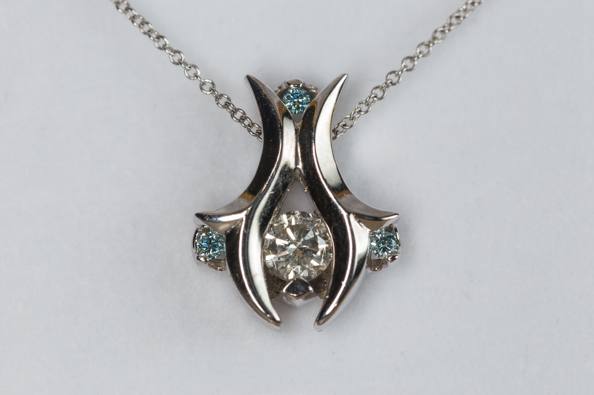 14k diamond pendant with blue diamond accents