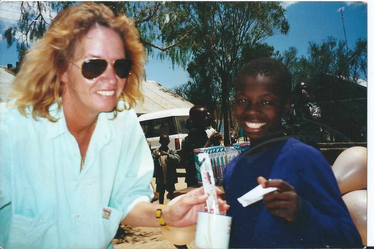 Debbie Case, the founder of Naivasha Children’s Shelter with one of the boys during the feeding program at the YMCA. Debbie died peacefully in hospital on December 30, 2013 after being diagnosed with cancer in June. Having lost her own daughter in terrible circumstances she put an enormous amount of love and energy into the Shelter, which was opened in 2003. 