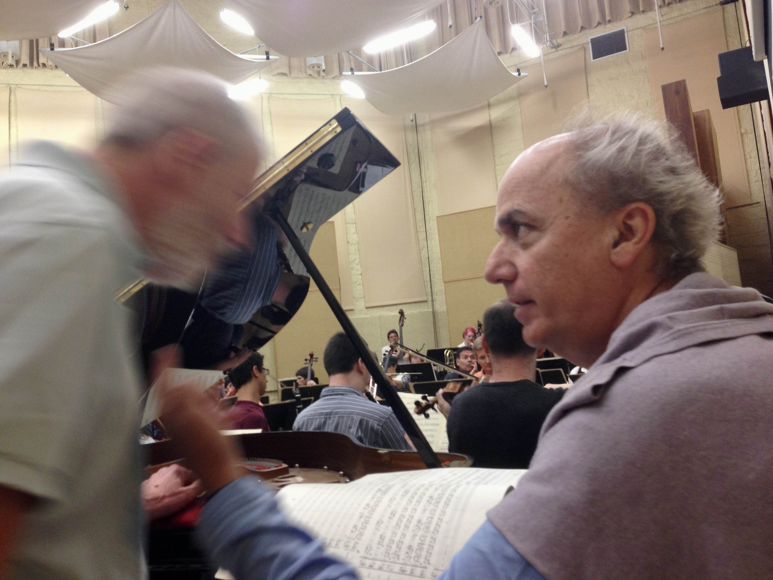 Maestro and Corky review the symphony score
