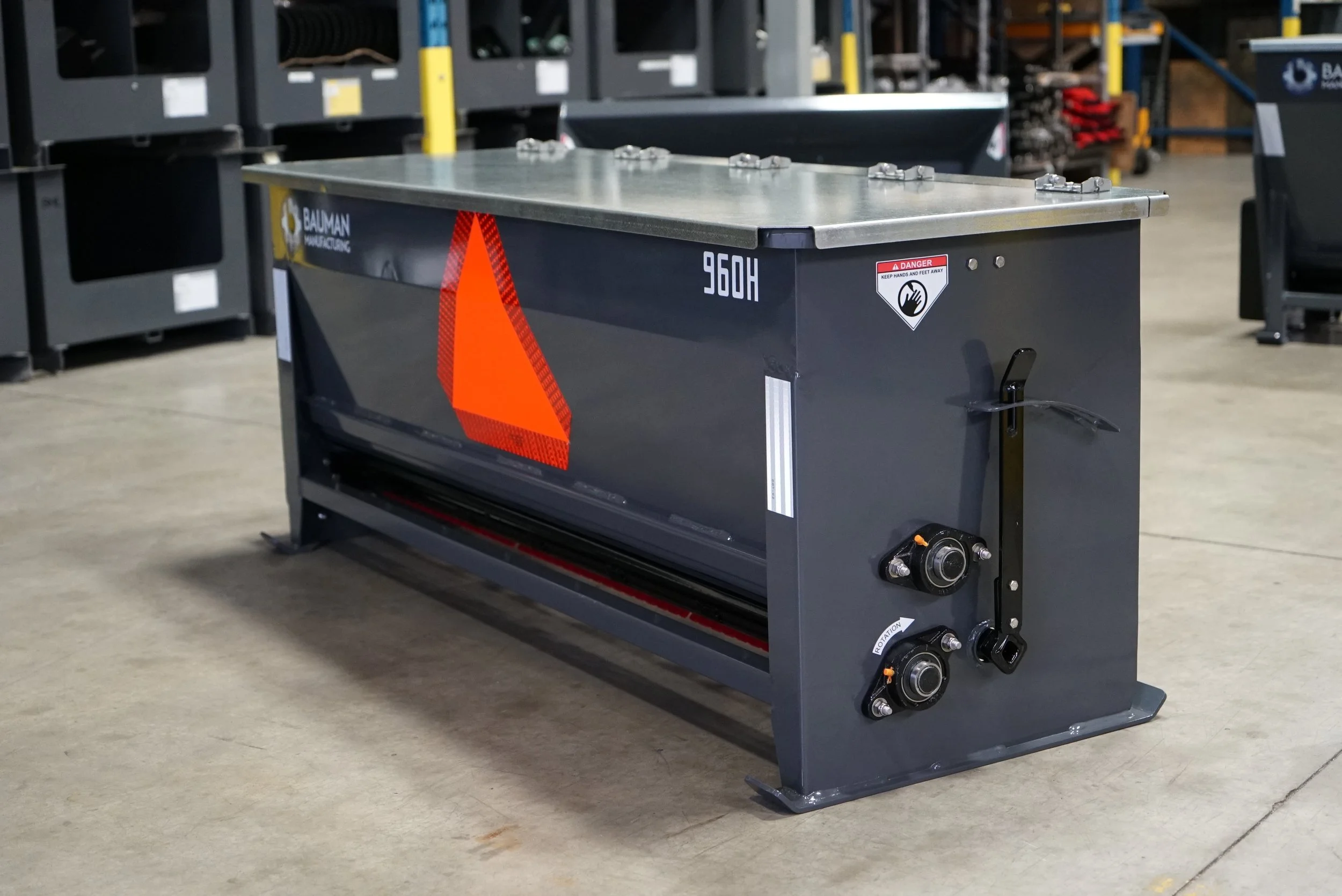 Bauman 960H Drop Spreader – side view of stainless steel spreader used for salt, sand, or fertilizer application.
