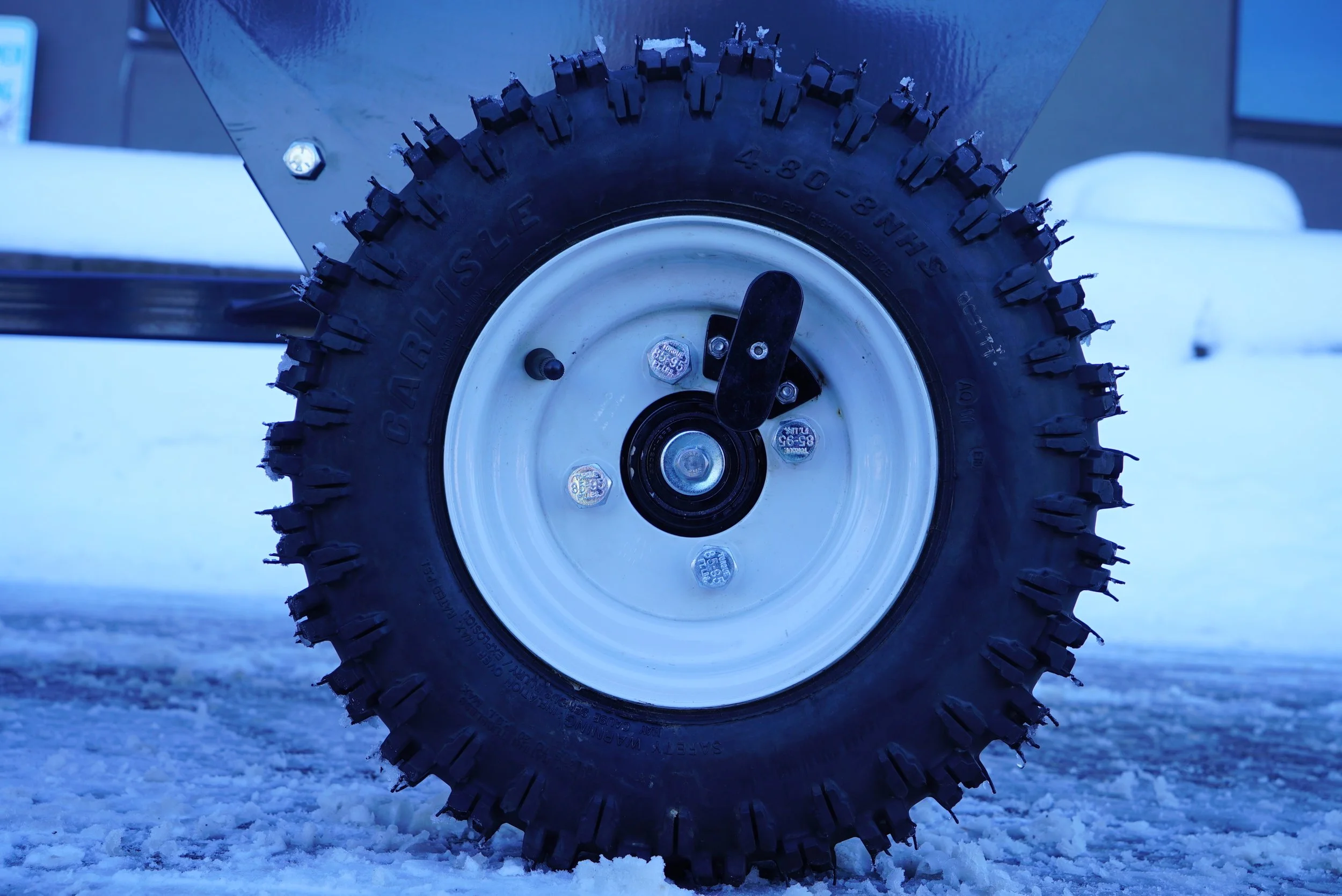 I image of how the Bauman 430T Drop spreader is connected to a running vehicle.