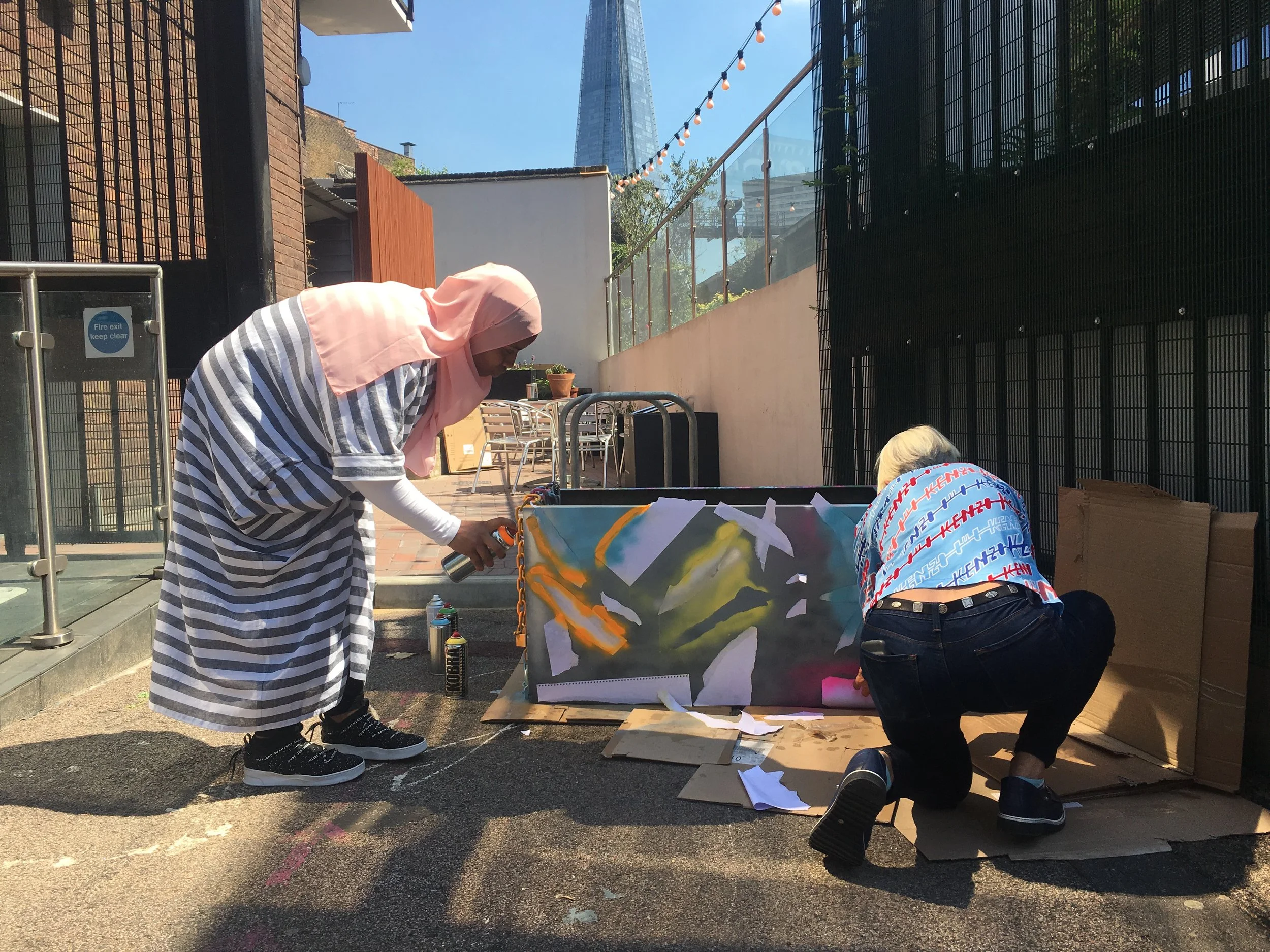 spray painting together RISE