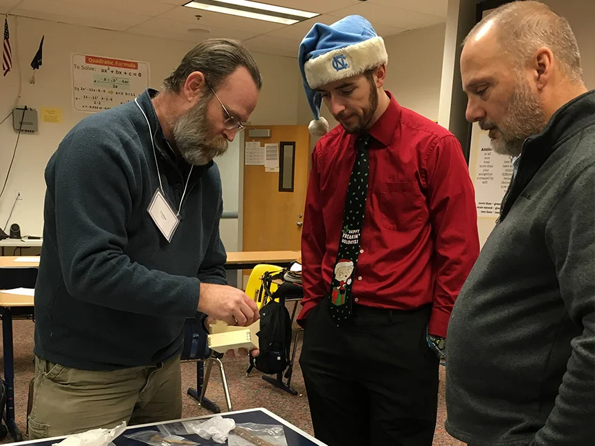 Archaeologist Morgan Blanchard showing artifacts to Kotzebue High School teachers (Dec 2015)