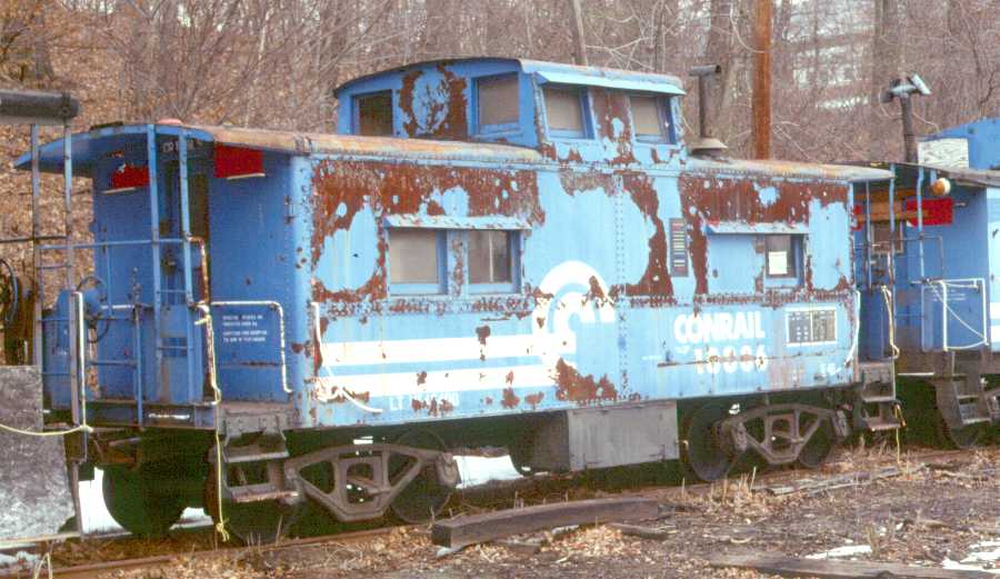 No. 18886 sits in Whippany, NJ in March of 1988, less than two years after Tri-State acquired it from Conrail. The circle bleeding through the Conrail paint on the cupola indicates the CNJ paint job this caboose received, erasing its L&NE heritage. (Karl Geffchen photo)
