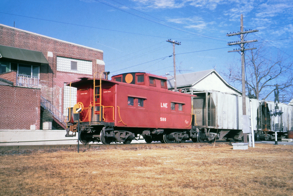 No. 580 brings up the rear of a CNJ train on the former L&NE at Green Street in Nazareth, PA on January 31, 1969. The CNJ kept the five former L&NE cabooses close to home and lettered them "LNE," but repainted them without a logo and added the large circle on the cupola. (Charles Houser photo, Rudy Garbely collection)