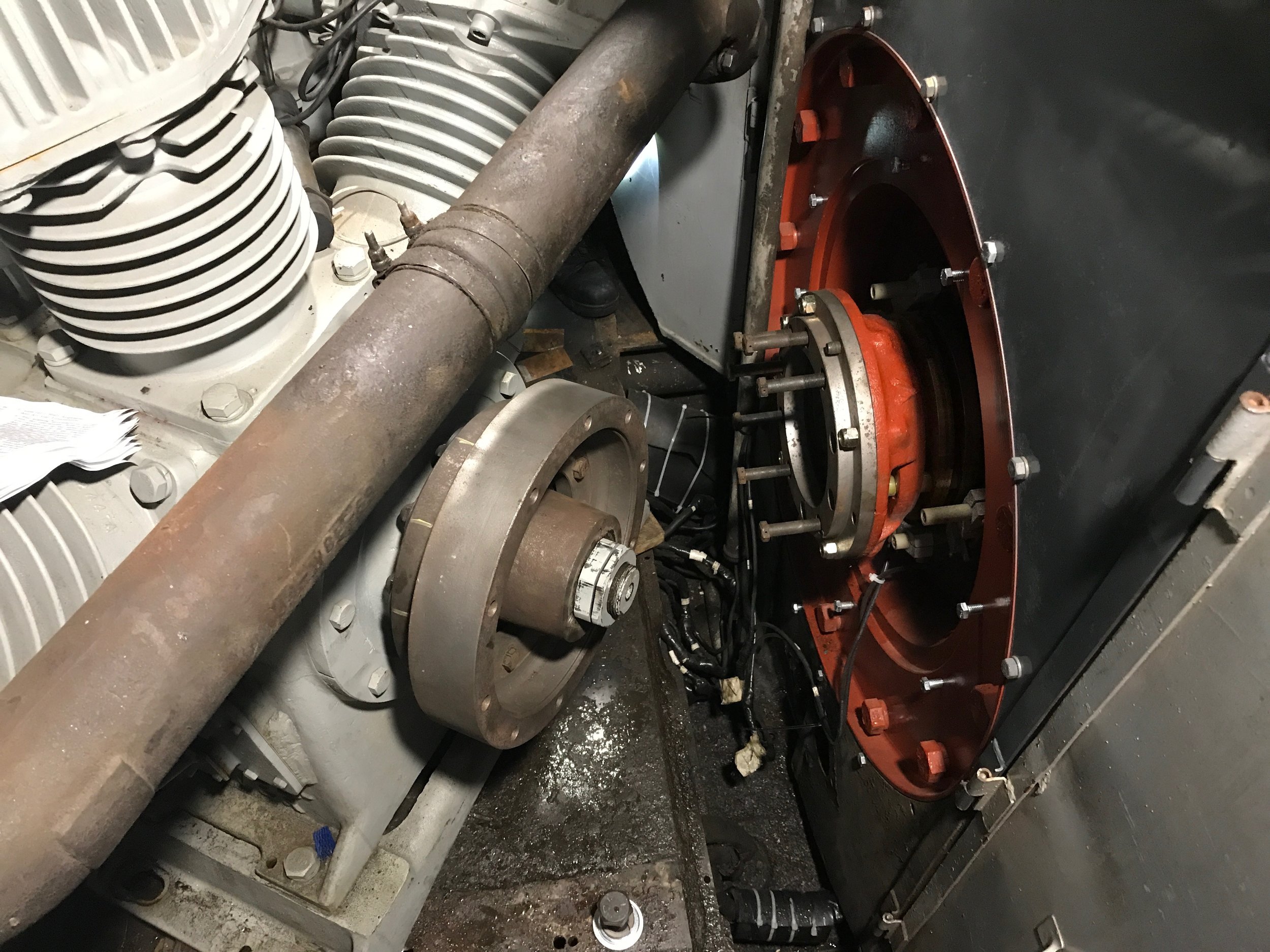  The new compressor coupling, shown on the left, was custom designed by the Santa Fe to withstand the forces put on the linkage between these to major parts while the locomotive is in motion. This was was taken from a derelict Santa Fe CF7 and was re