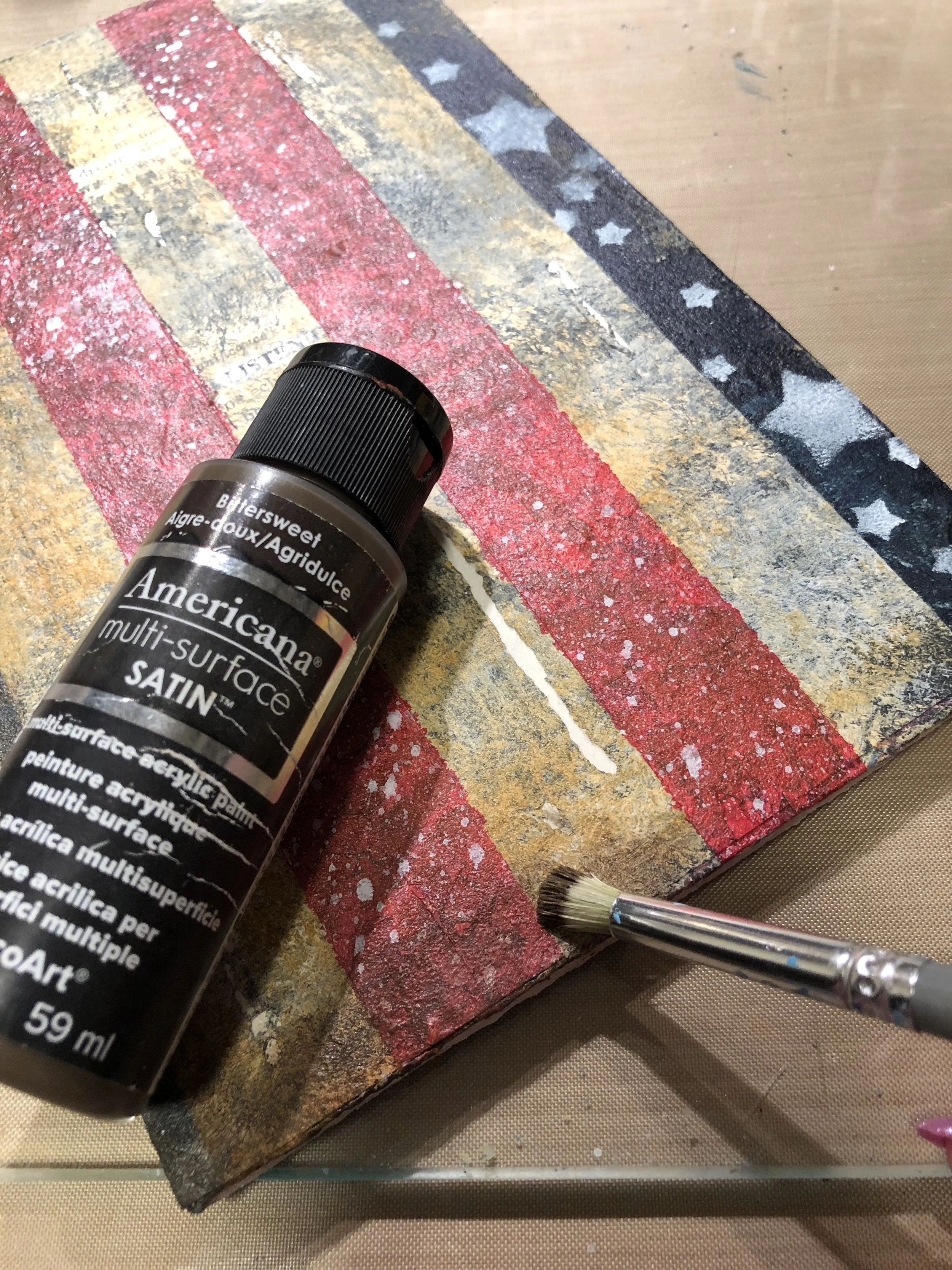 Dry brush DecoArt Americana Satin Acrylic in ‘Bittersweet’ around the edges of the piece.