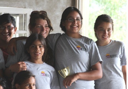 Here is Miranda (second from left in back row) with some of her champions.