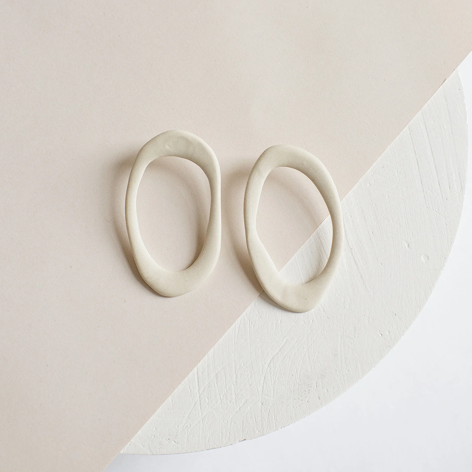 Organically Shaped Earrings Made of White Porcelain