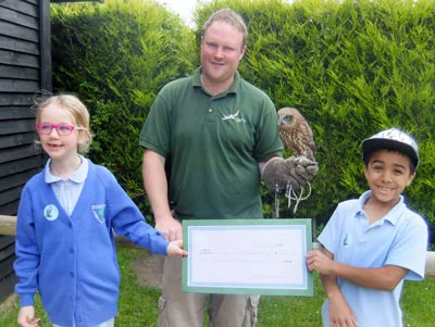 ITMA (ask your grandad) - Dean and Aukland together accept a very generous donation raised through the extra-ordinary efforts of a class from a local school. Thank you, guys - you did us proud!!