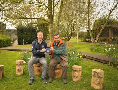 Andy received the award on behalf of S.O.S. on the new carved seats in ‘Teachers Corner’