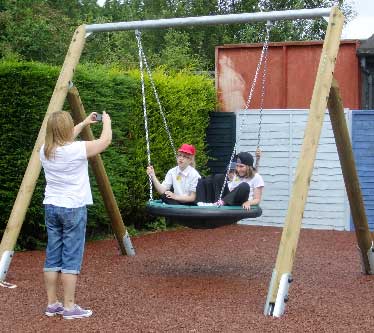 Smile please! The special swing is designed to carry 2-3 youngsters or can accommodate a carer on board