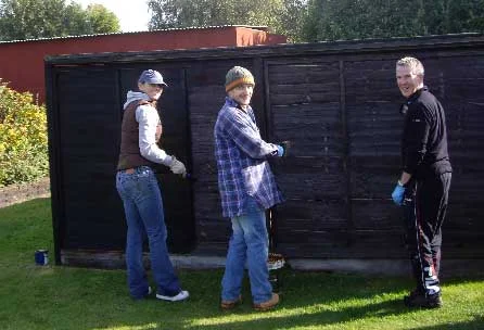 Painting the outside of some of the creche aviaries no doubt made a change from the daily desk routine - but there were no complaints!