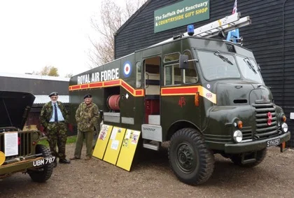 Green Goddess and Blonde Bombshell - above, four military stalwarts (2 human, 2 mechanical!) from times past, and below our Chief Fundraiser Maz about to take a look under the hood of a visiting Jeep